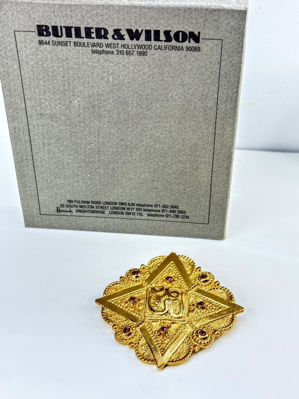 Vintage 1992 Butler & Wilson Gold Tone Hindu Om Brooch Purple Crystals GS852